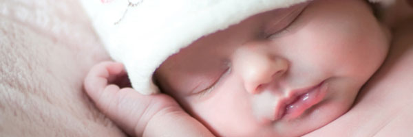 Baby sleeping with hat